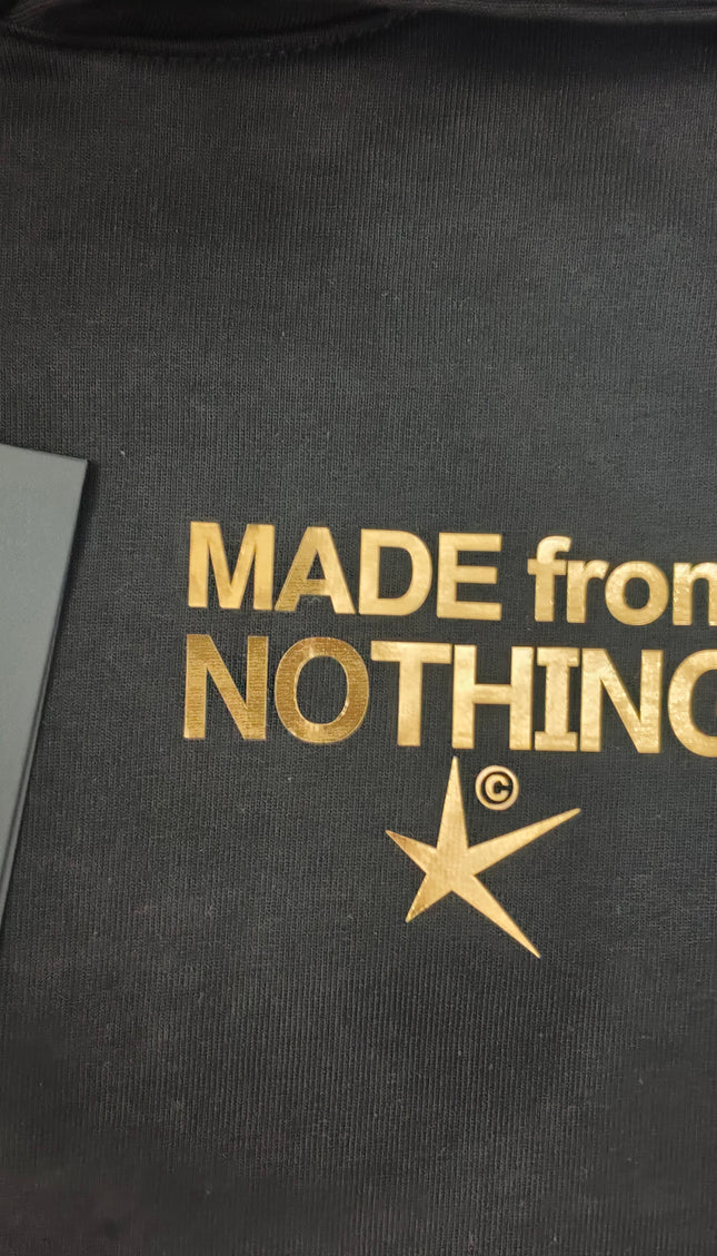 Tuta M. F. N nero logo in oro