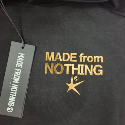 Tuta M. F. N nero logo in oro